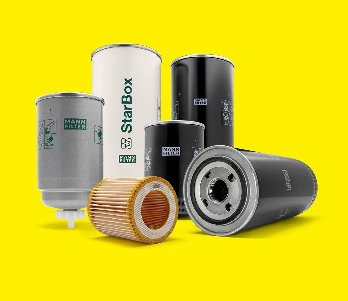 A selection of MANN-FILTER filters for compressors and vacuum pumps displayed on a yellow background
