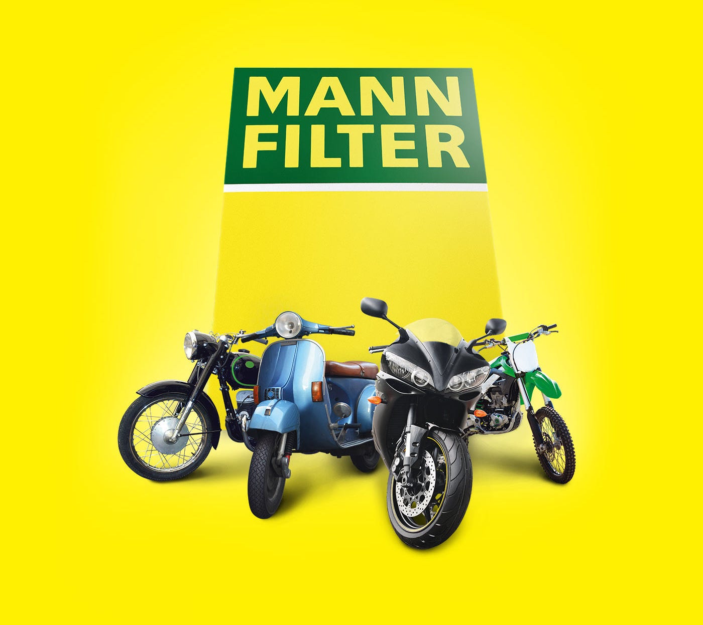 Four motorcycles displayed with a MANN-FILTER product packaging behind them