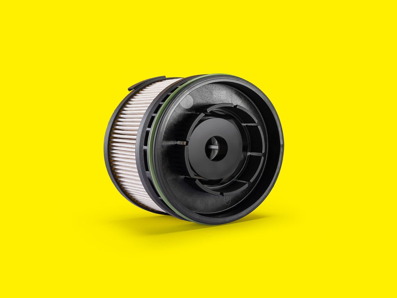Fuel filter element for cars and transporters by MANN-FILTER with black cap and pleated design