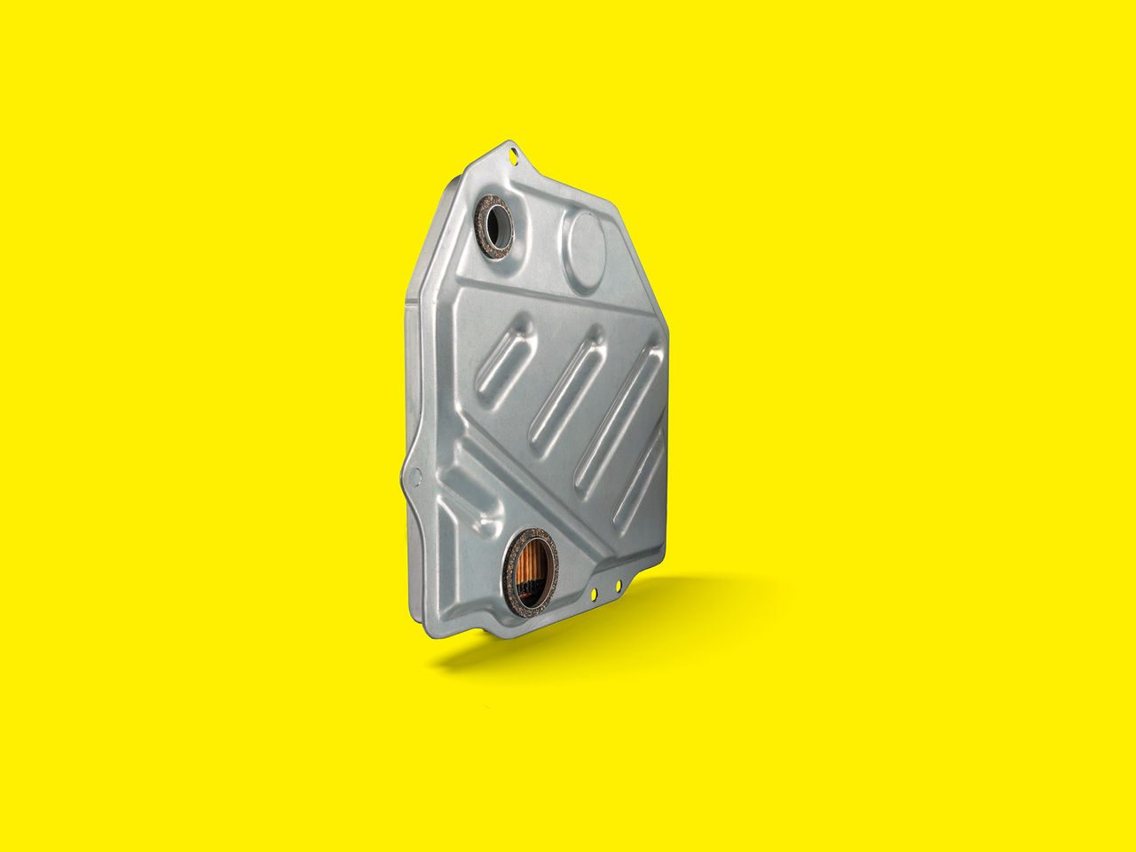 Silver MANN-FILTER transmission oil filter with a grooved design for optimum wear protection