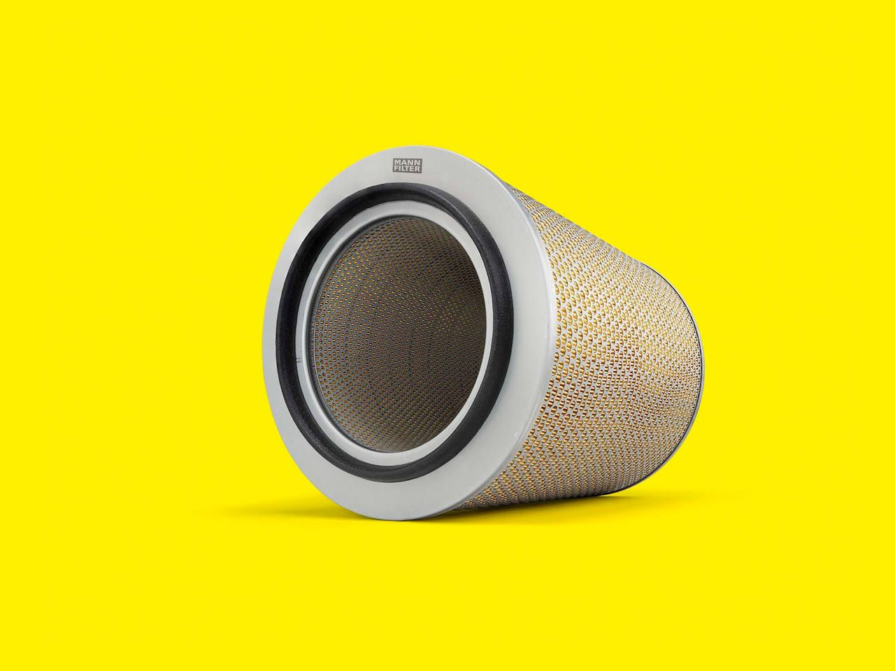 A cylindrical MANN-FILTER marine air filter with a black base displayed on a yellow background