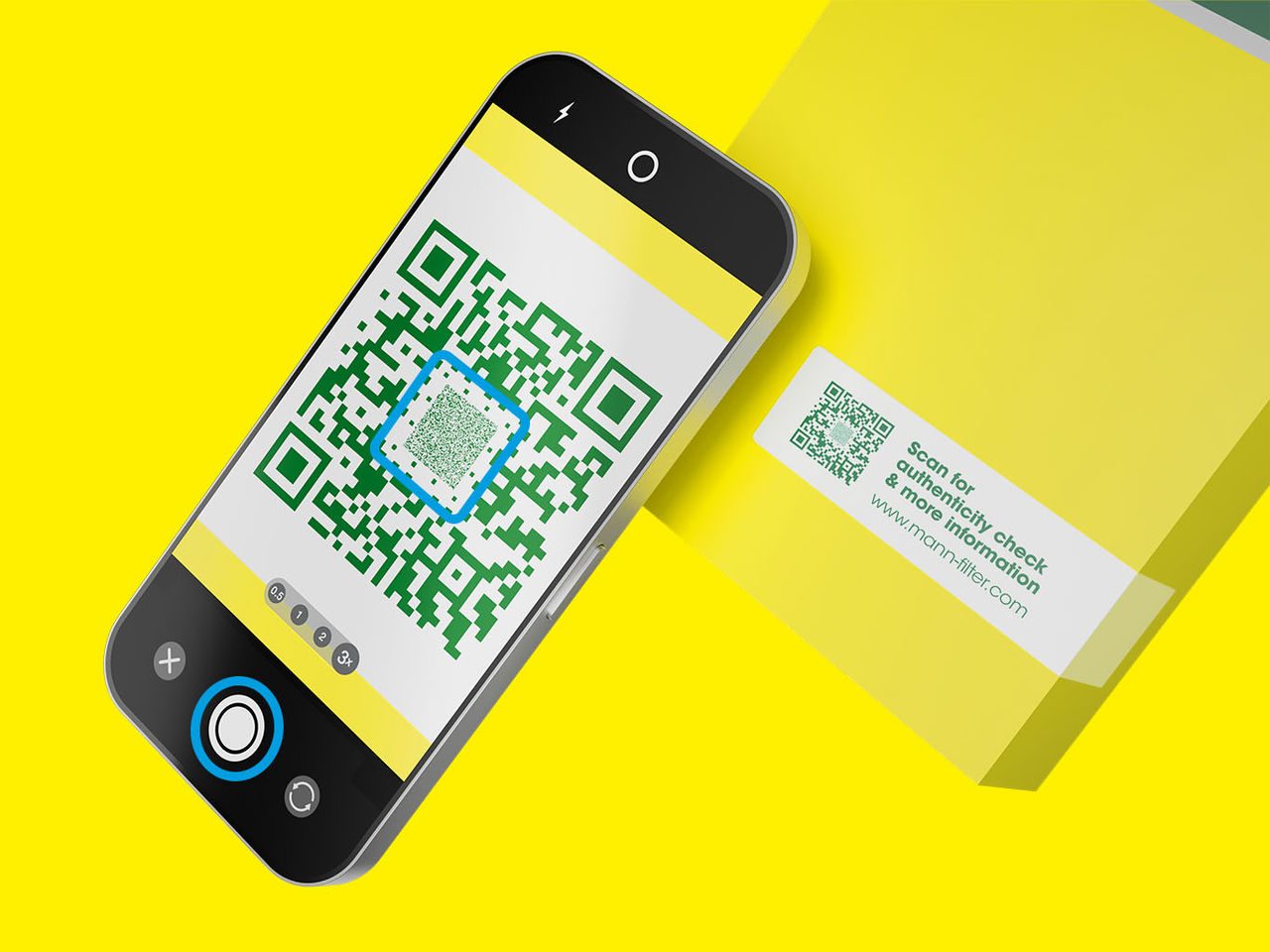 A smartphone taking a picture of the Secure QR Code on a yellow-green MANN-FILTER packaging