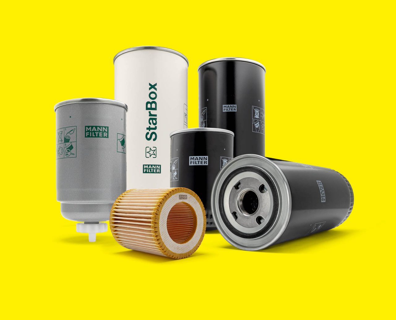 A selection of MANN-FILTER filters for compressors and vacuum pumps displayed on a yellow background